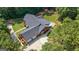 Aerial view of a brick house featuring an outdoor deck and a spacious three-car garage at 1000 Turner Church Rd, Mcdonough, GA 30252