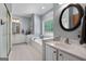 Bright bathroom with a bathtub, shower, double sink vanity, and tiled floors at 1000 Turner Church Rd, Mcdonough, GA 30252