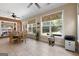 Eat-in kitchen features a dining table, tile floors and multiple windows at 1000 Turner Church Rd, Mcdonough, GA 30252
