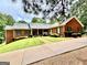 Lovely brick home with a well-maintained lawn, charming landscaping, and a paved driveway at 1000 Turner Church Rd, Mcdonough, GA 30252