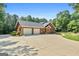 Spacious home featuring a three-car garage and ample parking space at 1000 Turner Church Rd, Mcdonough, GA 30252