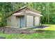 Detached two-car garage with a side entrance and ample storage space at 1000 Turner Church Rd, Mcdonough, GA 30252