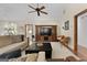 Spacious living room with hardwood floors, built-in entertainment center, and comfortable seating at 1000 Turner Church Rd, Mcdonough, GA 30252