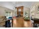 Cozy living room features hardwood floors, a brick fireplace, and natural light at 1000 Turner Church Rd, Mcdonough, GA 30252
