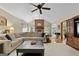 Inviting living room featuring vaulted ceilings, a brick fireplace, and ample natural light at 1000 Turner Church Rd, Mcdonough, GA 30252