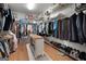 Spacious walk-in closet with custom shelving and an island for optimal organization at 1000 Turner Church Rd, Mcdonough, GA 30252