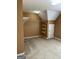 Spacious attic with carpeted floor and ample storage space with closet and shelving at 3381 Walkers Ridge Rd, Dacula, GA 30019