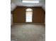 Finished attic space with natural light and window, perfect for a playroom or storage at 3381 Walkers Ridge Rd, Dacula, GA 30019