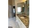 Granite countertops and white cabinets accent this bathroom at 3381 Walkers Ridge Rd, Dacula, GA 30019