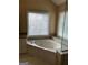 This bathtub is surrounded by two windows at 3381 Walkers Ridge Rd, Dacula, GA 30019