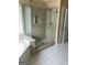 Bathroom featuring a glass-enclosed shower, soaking tub, and tile flooring at 3381 Walkers Ridge Rd, Dacula, GA 30019