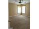 Bedroom with carpeted flooring, two windows, and neutral wall color at 3381 Walkers Ridge Rd, Dacula, GA 30019