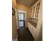 Butler's pantry with cabinetry and stone countertops leading to the dining area at 3381 Walkers Ridge Rd, Dacula, GA 30019