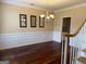 Dining room with wood floors, wainscoting, and a chandelier at 3381 Walkers Ridge Rd, Dacula, GA 30019