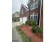 Brick home with a two-car garage and neat landscaping along the walkway at 3381 Walkers Ridge Rd, Dacula, GA 30019