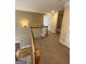 Hallway with carpeted flooring, complemented by white trim and neutral paint at 3381 Walkers Ridge Rd, Dacula, GA 30019