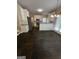 Open eat-in kitchen featuring dark tile floors, white cabinets and granite countertops at 3381 Walkers Ridge Rd, Dacula, GA 30019