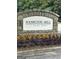 Stone entrance sign to Hamilton Mill featuring manicured landscaping and colorful flowerbeds at 3381 Walkers Ridge Rd, Dacula, GA 30019