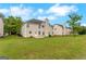The property has a backyard featuring a manicured lawn at 907 Brisley Cir, Hampton, GA 30228