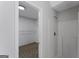 Bathroom view shows a shower and a walk-in closet with wire shelving at 907 Brisley Cir, Hampton, GA 30228