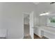 Bathroom with double vanity and white cabinets near the large bedroom at 907 Brisley Cir, Hampton, GA 30228