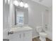 Bathroom featuring white vanity, toilet and bathtub at 907 Brisley Cir, Hampton, GA 30228