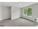 Spacious bedroom with neutral walls and carpet plus lots of natural light at 907 Brisley Cir, Hampton, GA 30228