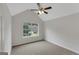 Bedroom featuring neutral walls, carpet floors, a window and a ceiling fan at 907 Brisley Cir, Hampton, GA 30228