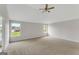 Large bedroom with plush carpet, a ceiling fan, and lots of natural light at 907 Brisley Cir, Hampton, GA 30228