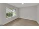 Empty room with new vinyl flooring and a large window at 907 Brisley Cir, Hampton, GA 30228