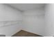 Walk-in closet with wire shelving and neutral carpet flooring at 907 Brisley Cir, Hampton, GA 30228