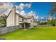 Large grassy backyard with a covered patio and fenced perimeter at 150 Bellemeade Ct, Fayetteville, GA 30215
