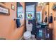 Chic half-bathroom with unique sink, fixtures, and colorful decor at 150 Bellemeade Ct, Fayetteville, GA 30215