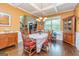 Bright dining room featuring hardwood floors, coffered ceilings, and plenty of natural light at 150 Bellemeade Ct, Fayetteville, GA 30215