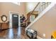 Spacious foyer with hardwood floors, staircase, and decorative details at 150 Bellemeade Ct, Fayetteville, GA 30215