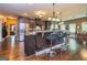 Well-lit kitchen with a center island, stainless steel appliances, and bar stool seating at 150 Bellemeade Ct, Fayetteville, GA 30215