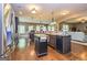 Spacious kitchen features stainless appliances, an island, and an open layout to living room at 150 Bellemeade Ct, Fayetteville, GA 30215