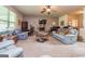 Spacious living room with a stone fireplace and plenty of seating for entertaining at 150 Bellemeade Ct, Fayetteville, GA 30215