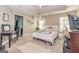 Spacious carpeted main bedroom featuring a ceiling fan and bright window at 150 Bellemeade Ct, Fayetteville, GA 30215