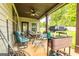 Covered patio with seating, fan, and view of the backyard at 150 Bellemeade Ct, Fayetteville, GA 30215