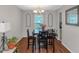 Cozy dining room with hardwood floors, a wooden table set, and natural light at 3823 Rock Hollow Ct, Conley, GA 30288