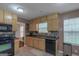 Functional kitchen featuring tile floors, ample cabinet space, and modern appliances at 3823 Rock Hollow Ct, Conley, GA 30288