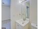 Bathroom with a white vanity, new trim, and laminate flooring at 4547 Atha Cir, Loganville, GA 30052