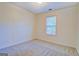 Bedroom featuring a large window, neutral walls, and new carpet at 4547 Atha Cir, Loganville, GA 30052