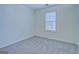 Bedroom featuring a large window, neutral walls, and new carpet at 4547 Atha Cir, Loganville, GA 30052