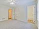 Bedroom with new carpet flooring and an en-suite bathroom at 4547 Atha Cir, Loganville, GA 30052