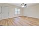 This bedroom features a ceiling fan, laminate flooring, and a private entrance at 4547 Atha Cir, Loganville, GA 30052