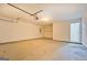 Spacious two-car garage with an automatic opener and ample storage space at 4547 Atha Cir, Loganville, GA 30052