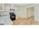 The kitchen features white cabinets and black appliances at 4547 Atha Cir, Loganville, GA 30052