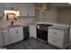 Well-equipped kitchen featuring white cabinets, granite countertops, stainless steel appliances, and stylish backsplash at 6286 Saddlewood Dr, Lithonia, GA 30058